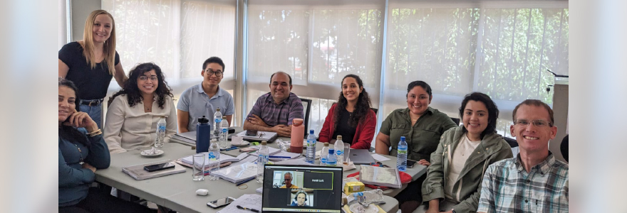 Researcher Heidi Luft (standing on the left) is joined by colleagues from the Ministry of Education, Fourth R developers (virtual), and Fourth R project teams from the U.S. and Nicaragua during a multi-day adaptation workshop in the Dominican Republic.